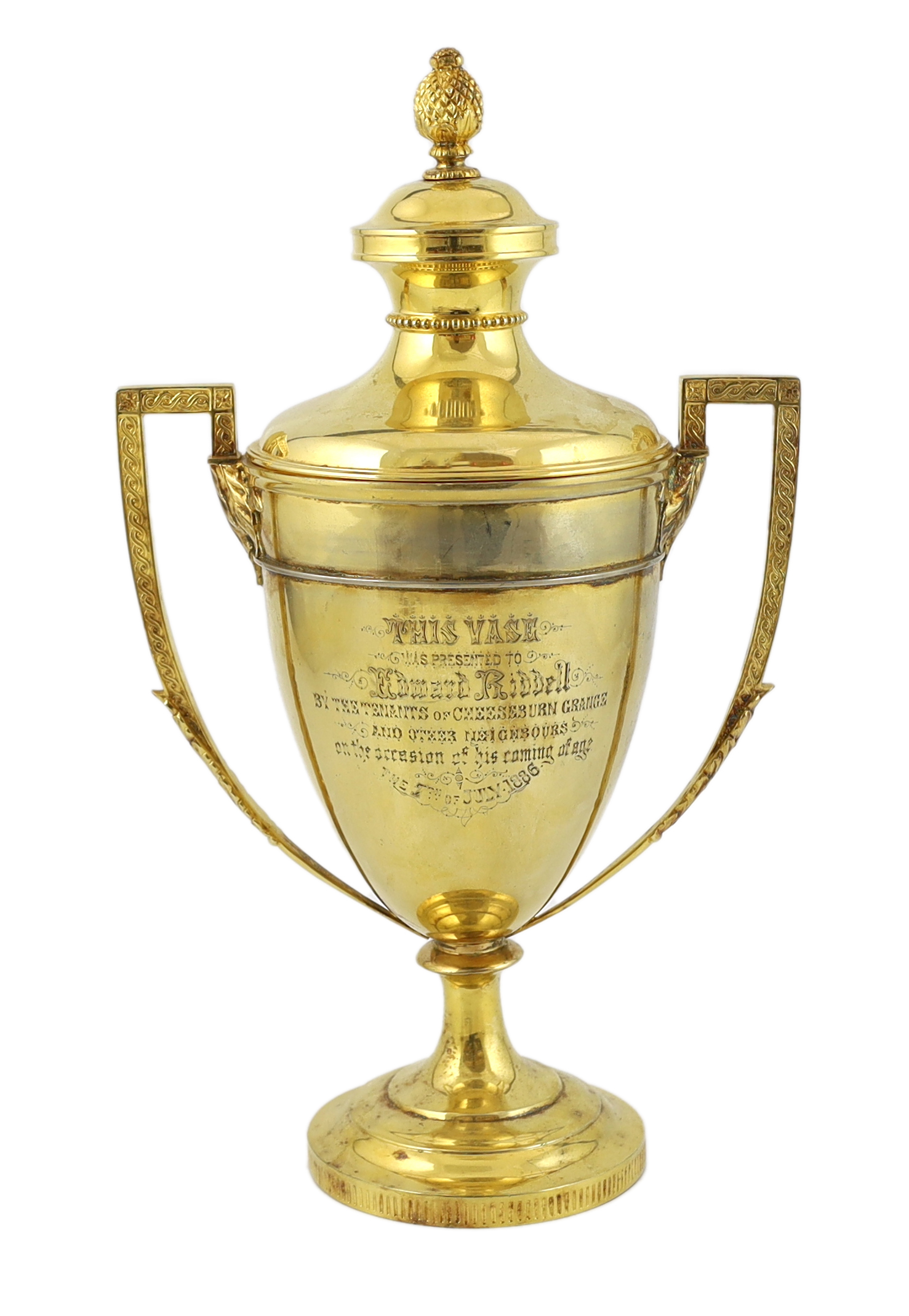 A late Victorian silver gilt two handled vase shaped presentation trophy cup